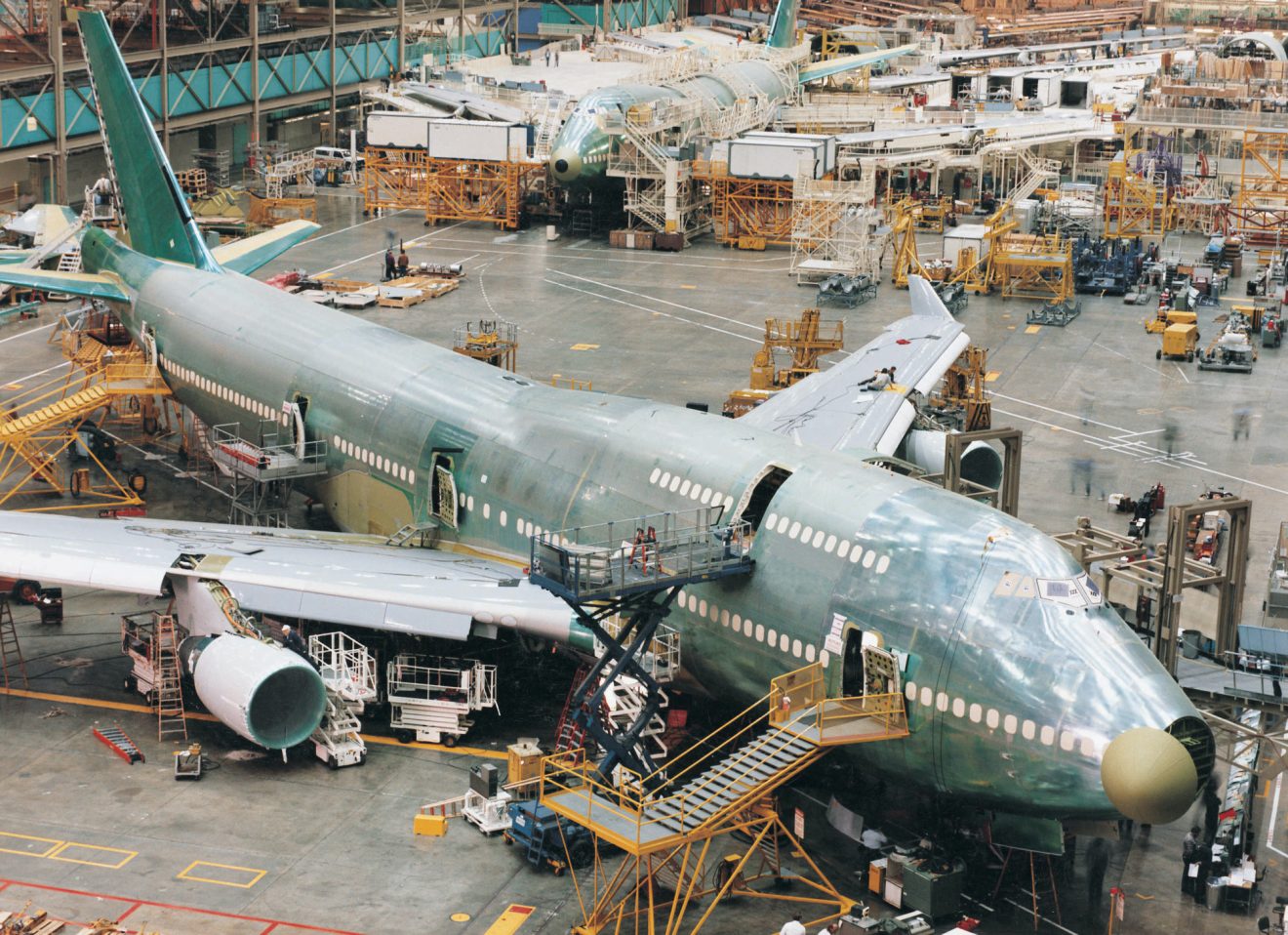 An airplane is assembled in a warehouse