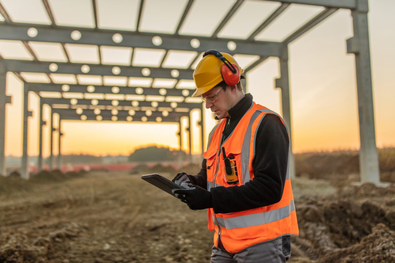 Person on tablet on construction site